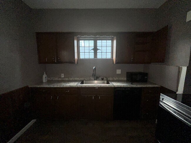 Building Photo - "Charming 4-Bedroom Oasis: Your Perfect Bl...