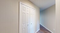 This two-story home in the Greenbriar neighborhood of Memphis, Tennessee offers a well-organized layout spread across two floors. The main level features a bright, open living room with hardwood-style flooring, a ceiling fan, and multiple windows that invite ample natural light, along with direct access to the outdoors. The kitchen is thoughtfully updated with white shaker cabinets, granite countertops, a classic subway tile backsplash, and stainless steel appliances including a dishwasher and refrigerator. A half bathroom on the main floor adds everyday convenience.

Upstairs, three bedrooms provide comfortable accommodations, each with plush carpeting and generous closet space. The spacious primary bedroom features vaulted ceilings that lend an airy, open feel, along with a dedicated walk-in closet. Additional bedrooms are well-sized, with large windows offering natural light and views of the surroundings. The two full bathrooms upstairs are finished with white vanities, granite countertops, and clean, bright fixtures — one featuring a full tub-shower combination.

Throughout the home, neutral tones, textured ceilings, and consistent finishes create a cohesive and move-in ready atmosphere, making this Greenbriar residence a functional and inviting place to call home.