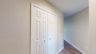 This two-story home in the Greenbriar neighborhood of Memphis, Tennessee offers a well-organized layout spread across two floors. The main level features a bright, open living room with hardwood-style flooring, a ceiling fan, and multiple windows that invite ample natural light, along with direct access to the outdoors. The kitchen is thoughtfully updated with white shaker cabinets, granite countertops, a classic subway tile backsplash, and stainless steel appliances including a dishwasher and refrigerator. A half bathroom on the main floor adds everyday convenience.

Upstairs, three bedrooms provide comfortable accommodations, each with plush carpeting and generous closet space. The spacious primary bedroom features vaulted ceilings that lend an airy, open feel, along with a dedicated walk-in closet. Additional bedrooms are well-sized, with large windows offering natural light and views of the surroundings. The two full bathrooms upstairs are finished with white vanities, granite countertops, and clean, bright fixtures — one featuring a full tub-shower combination.

Throughout the home, neutral tones, textured ceilings, and consistent finishes create a cohesive and move-in ready atmosphere, making this Greenbriar residence a functional and inviting place to call home.