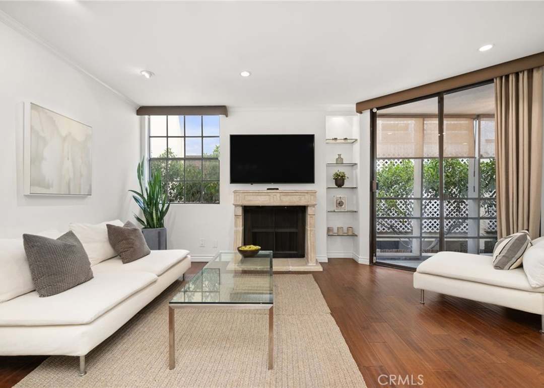 Living room with door to Patio - 750 N Kings Rd