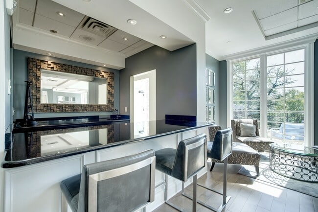 Expansive Resident Clubhouse with Plush Seating Areas, Cozy Fireplace, Balcony Area, and Bar - The Park At Arlington Ridge