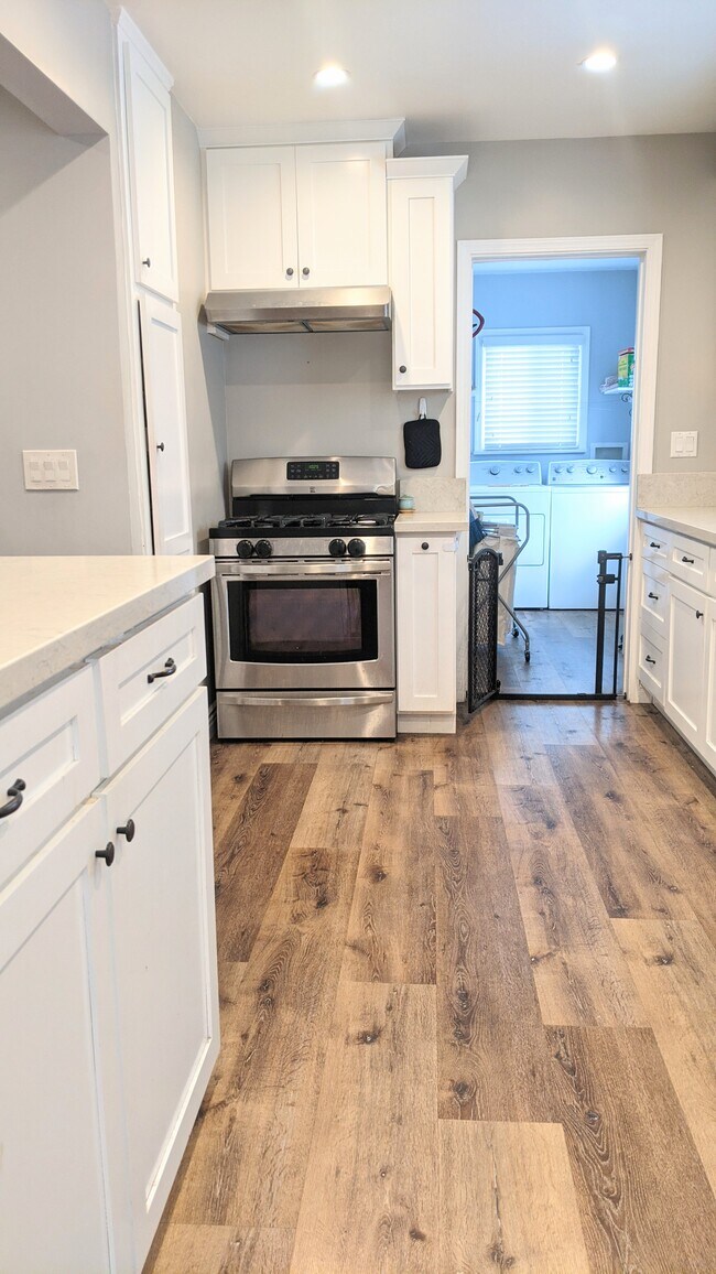 Waterproof vinyl blank flooring throughout. - 8184 Madison Ave
