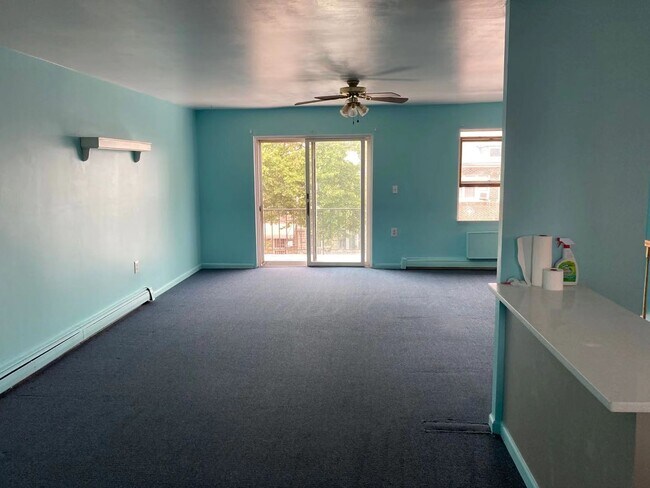 Living area with dining area next to open kitchen - 1758 80th St
