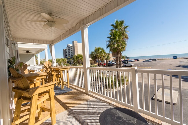 Spacious porch with lots of seating - 106 W Arctic Ave