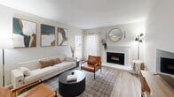Located at 1000 Forest Oak Dr in Charlotte, NC, this one-bedroom, one-bathroom residence offers a well-organized layout across a single floor. The living room serves as the heart of the home, featuring a classic white-framed fireplace, wood-style flooring, and bright windows with sheer curtains that fill the space with natural light. The open sightlines create a comfortable, inviting atmosphere ideal for both relaxing and entertaining.

The galley-style kitchen is thoughtfully appointed with granite countertops, two-tone cabinetry featuring white upper and gray lower cabinets, stainless steel appliances including a refrigerator and electric range, and a double basin sink. The layout maximizes efficiency while maintaining a clean, modern aesthetic.

The bedroom is a quiet, carpeted retreat with a window that brings in soft natural light. A dedicated closet provides practical storage. The full bathroom continues the design cohesion of the unit, showcasing granite vanity counters, gray cabinetry, wood-style flooring, and a tub-shower combination. A hallway connects the rooms seamlessly, completing this efficiently designed and stylishly finished Charlotte residence.