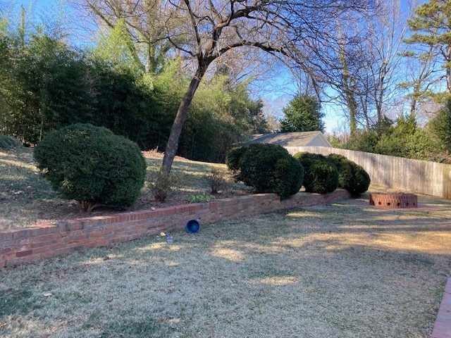 Large, private backyard with brick patio and fire pit - 5712 Telfair Rd