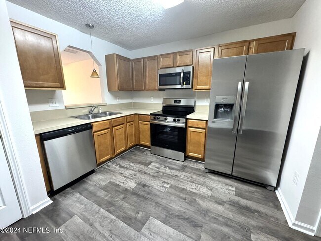 Building Photo - 8440 McGirts Village Ln