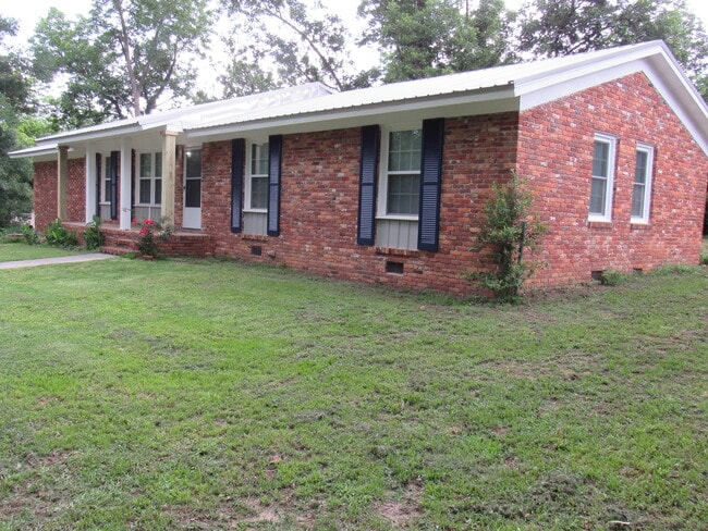 Corner view of house - new corner posts on front deck will be painted white. - 2215 Macy Ave