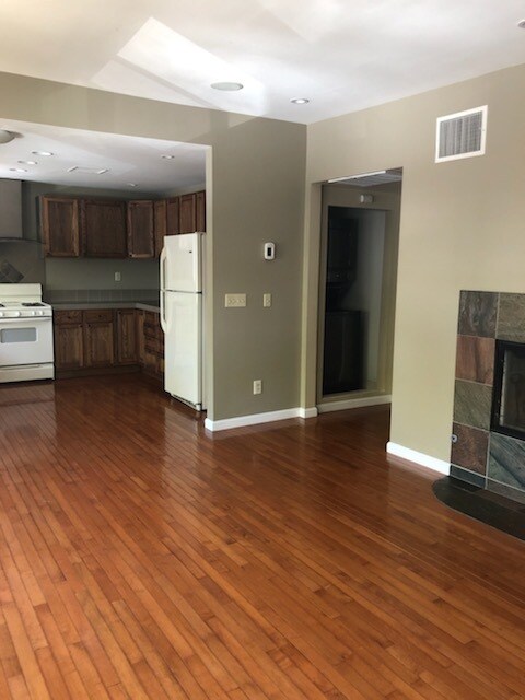 Beautiful stained wood flooring throughout. Fire place. - 2603 University Ave