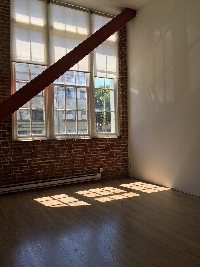 Living Area with original brick of the Schmidt Lithograph Factory - 461 2nd St