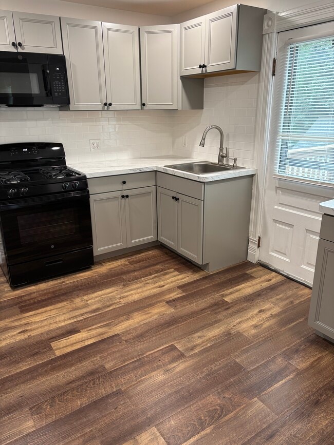 Updated kitchen, subway tile backsplash - 721 E Clinton St