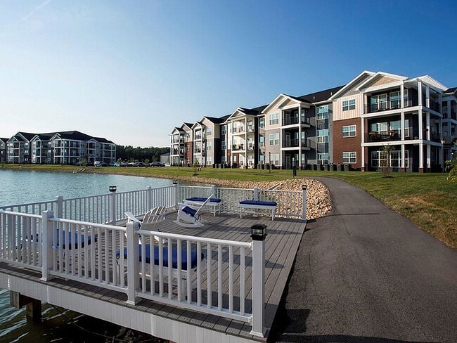 A deck overlooking the pond provides a serene place to relax or fish. - WaterStone at Green River