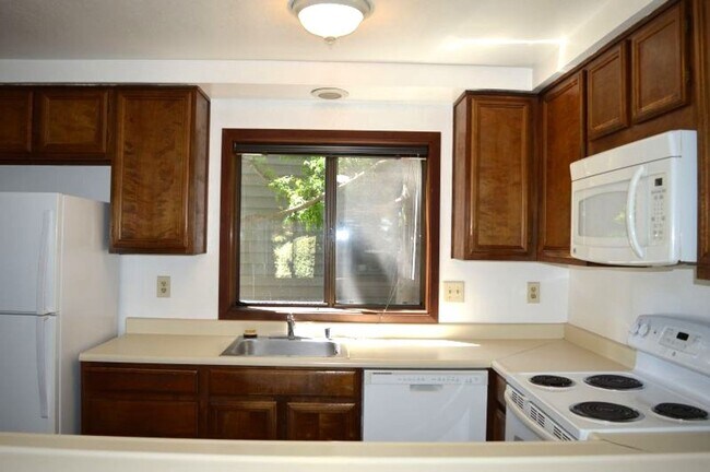 Building Photo - Spacious and Conveniently Located with Private Patio and Parking