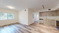 Located at 2480 NW 48th St in Miami, FL, this single-story, 4-bedroom, 2-bathroom home offers a clean, modern aesthetic throughout. Light-toned luxury vinyl plank flooring flows consistently across the living areas and bedrooms, lending a cohesive and contemporary feel to the entire space.

The kitchen is a standout feature, equipped with stainless steel appliances including a refrigerator, electric range, microwave, and dishwasher. Light wood-grain cabinetry extends to the ceiling, maximizing storage, while white countertops and track lighting complete the bright, functional design.

Each of the four bedrooms is bright and airy, benefiting from natural light admitted through slatted window blinds and ceiling fans that provide comfort and ventilation. Several bedrooms include built-in closets with folding doors for added storage convenience.

The two bathrooms are finished in a modern style with light wood-tone vanity cabinetry, white countertops, and large-format tile flooring. One bathroom features a dual-sink vanity with a wide mirror and contemporary fixtures, while the second offers a clean, straightforward layout with ample counter space.

A central hallway connects the rooms efficiently, and a dedicated closet adds further storage capacity. The overall ambiance is bright, neutral, and move-in ready, reflecting a refreshed interior well-suited for comfortable living in Miami.