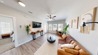 This 1-bedroom, 1-bathroom residence in Devon offers a thoughtfully designed single-floor layout that maximizes every square foot. The living room serves as the heart of the home, featuring light gray walls, wood-style flooring, a ceiling fan with light fixture, and ample natural light streaming through large windows. The open arrangement comfortably accommodates both a living and dining area, creating a versatile and welcoming space.

The kitchen is equipped with dark wood cabinetry extending to the ceiling for generous storage, granite-style countertops, stainless steel appliances, and light hardwood flooring — combining style with practicality. A dedicated dining area adjacent to the living space completes the main living zone.

The bedroom offers a comfortable retreat with plush carpeting, a ceiling fan, a window with natural light, and access to a dedicated closet. The bathroom includes a tiled tub-shower combination, a granite-topped vanity with dark wood cabinetry, and wood-style flooring, maintaining the consistent aesthetic found throughout the unit.

Additional highlights include an in-unit laundry area with washer and dryer hookups, and a private patio for outdoor enjoyment. The overall design is clean, modern, and cohesive, making this an efficient and inviting residence.