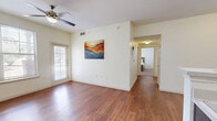 Located on S Midkiff Rd in Midland, TX, this well-designed 2-bedroom, 2-bathroom single-floor unit offers a practical and comfortable layout. The kitchen is a standout feature, showcasing rich dark espresso cabinetry, light countertops, black appliances including an electric range and microwave, and warm wood-style flooring that extends into the living and dining areas. A breakfast bar with pendant lighting provides a casual dining option and opens the space for easy flow and entertaining.

Both bedrooms are carpeted and bright, with natural light filtering in through window blinds. The primary bedroom offers a comfortable footprint, while the second bedroom is versatile and well-suited for guests or a home office. Each room is finished with clean white walls and neutral tones throughout.

The two bathrooms are efficiently designed, each featuring dark vanity cabinetry with white countertops and tile flooring. One bathroom includes a full tub-shower combination with white subway tile surround, while the other offers a vanity with a large mirror. A dedicated closet and hallway round out the floor plan, providing practical storage and connectivity between rooms. The overall ambiance is clean, neutral, and move-in ready.