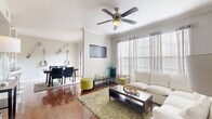 Located at 250 Treeline Park in San Antonio, Texas, this three-story, three-bedroom, three-bathroom home offers a well-organized layout spread across multiple levels. The ground-floor entrance leads to a staircase with rich dark-wood treads that connect each floor with a warm, cohesive aesthetic. The main living level features an open-concept living and dining area with gleaming hardwood floors, crown molding, and ceiling fans that enhance airflow and comfort. Large windows dressed in sheer curtains fill the space with natural light. The dining area includes a playful, artistic touch with oversized decorative cutlery wall art. The kitchen is outfitted with stainless steel appliances, white cabinetry, dark granite countertops, and a mosaic tile backsplash, along with a pantry for added storage. Each of the three bedrooms offers plush carpeting, natural light, ceiling fans, and ample closet space. The bathrooms feature white cabinetry, dark granite countertops, and hardwood-style flooring. A dedicated laundry room and a private balcony add everyday convenience and outdoor access. Hallways and staircases connect the floors efficiently, making this multi-level home feel both functional and inviting throughout.