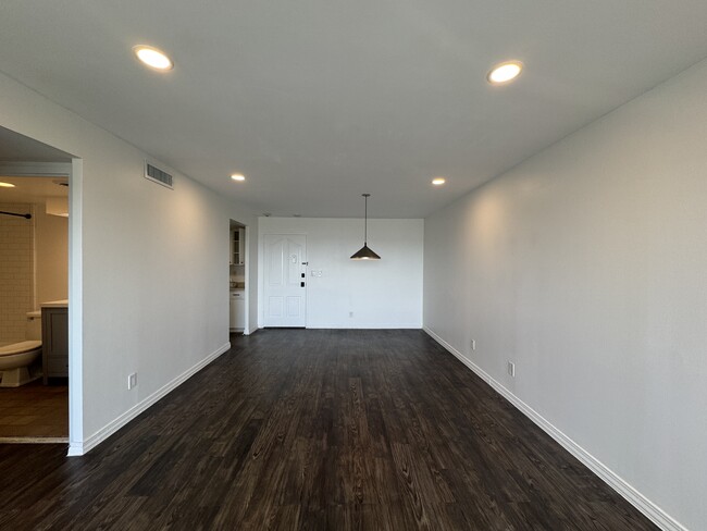 Living room with updated dimmable LED lighting. - 1502 S Boulder Ave