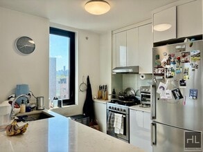 Building Photo - Stunning rent stabilized 1 bedroom with private balcony, onsite laundry, gym & roof deck
