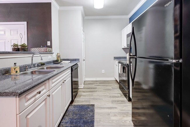 Large Eat In Kitchens with Black Appliances - Parkways on Prairie Creek
