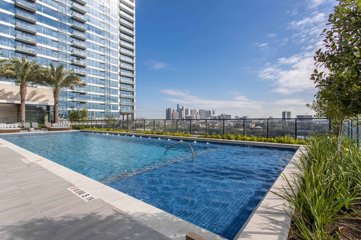 Luxurious rooftop pool with panoramic city skyline views - The Residences at La Colombe d'Or