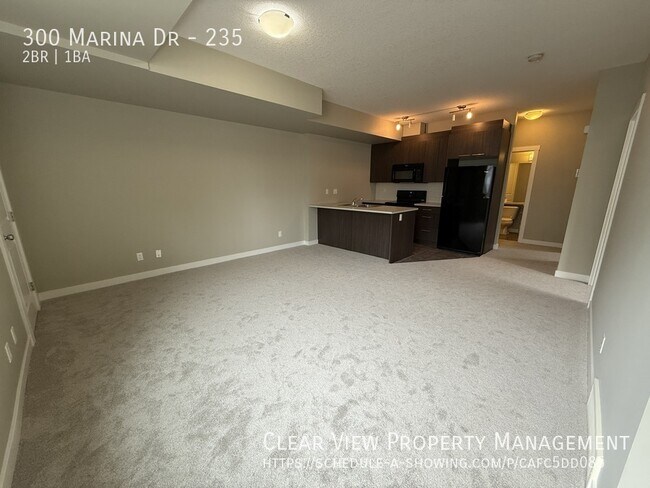 Building Photo - Beautiful 2 bedroom ground floor Condo with New Carpet in Chestermere Station!! ??PROMO: 1ST HALF...