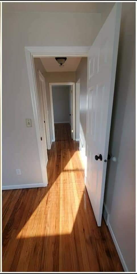 In one bedroom, looking down hall - 237 S Broadway Ave