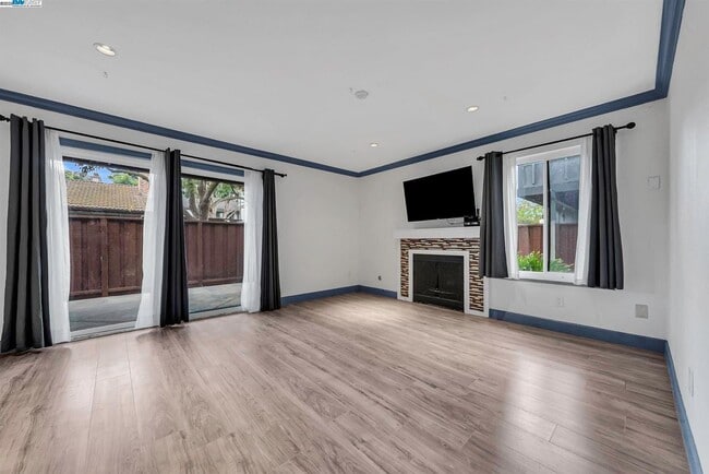 living room with wood burning fireplace - 6266 Joaquin Murieta Ave