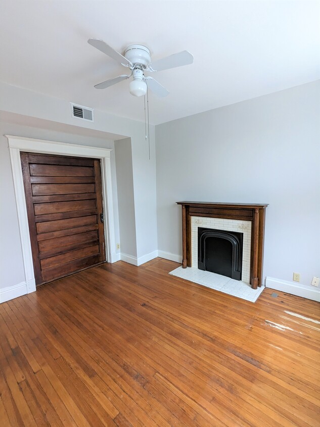 Livingroom with pocket door and fireplace - 4577 Gibson Ave