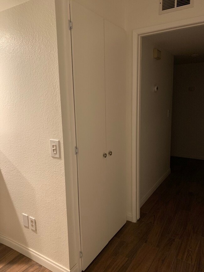 In unit washer/dryer and hallway leading to 3 bedrooms. - 3881 Groton St