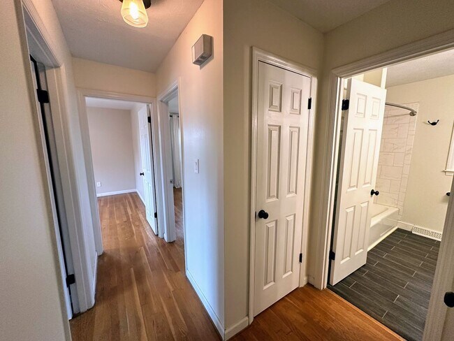 Building Photo - AVAILABLE NOW! Spacious 4 BR, 2 Bath House! Wood Floors, Attached Garage, W/D Included