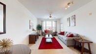 Located in Clermont, FL, this well-appointed one-bedroom, one-bathroom residence offers a thoughtfully designed single-floor layout that maximizes every square foot. The welcoming entrance flows into a bright, carpeted living room bathed in natural light from large windows and a glass-paned patio door. A ceiling fan overhead and a track lighting system add to the room's functionality, while the open feel makes it ideal for relaxing or entertaining. The patio provides a private outdoor retreat with direct access from the living area. The galley-style kitchen is efficiently organized with warm wood cabinetry, light stone countertops, and clean white appliances including a refrigerator, electric range, microwave, and dishwasher. Light tile flooring runs throughout the kitchen and entry areas, creating a cohesive and easy-to-maintain surface. The bedroom is a comfortable, carpeted retreat featuring a ceiling fan, a generous window that lets in natural light, and ample closet space — with three closets spread throughout the unit offering exceptional storage. The full bathroom includes a soaking tub-shower combination with tile surround. A dedicated laundry area and utility room round out this practical and comfortable home.