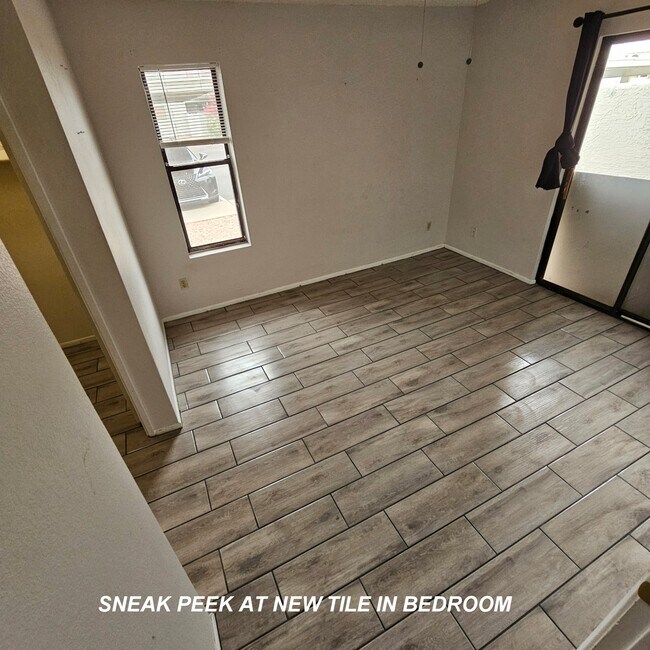 sneak peek at flooring in bedroom #2 - 850 S River Dr