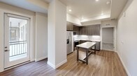Located at 3444 South Emerson Street in Englewood, Colorado, this 1-bedroom, 1-bathroom residence offers a thoughtfully designed layout with modern finishes throughout. The open-concept kitchen serves as the heart of the home, featuring wood-grain cabinetry, white quartz countertops, stainless steel appliances including a French door refrigerator, electric range, and microwave, as well as wood-look plank flooring that extends into the living area. A central kitchen island provides additional prep and dining space, enhancing the room's functionality.

The living area flows naturally from the kitchen, bathed in recessed lighting that creates a bright, welcoming ambiance. Neutral-toned walls complement the overall modern aesthetic throughout the space. The generously sized bedroom is finished with plush wall-to-wall carpeting, recessed lighting, and crisp white trim, offering a comfortable and serene retreat. A dedicated closet provides ample storage.

The full bathroom is finished with wood-look tile flooring, a wood-grain vanity with white countertop, and a tiled shower-tub combination with chrome fixtures, balancing style and practicality. Clean lines, consistent neutral tones, and contemporary materials unify the space, creating a cohesive and move-in-ready home.