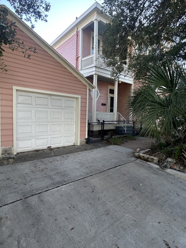 Garage in the foreground comes with the apartment. There is a garage door opener. - 1118 25th St