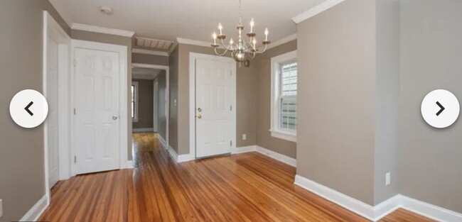 Dining room with hallway into living room - 126 N College St