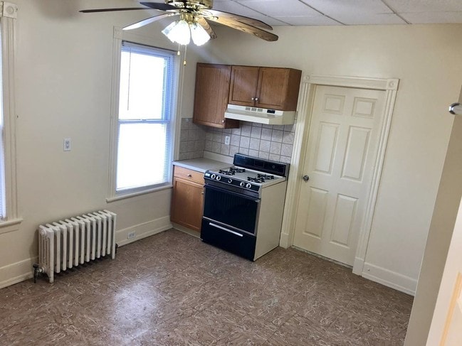 Eat in kitchen features gas oven and fridge - 224 E Main St