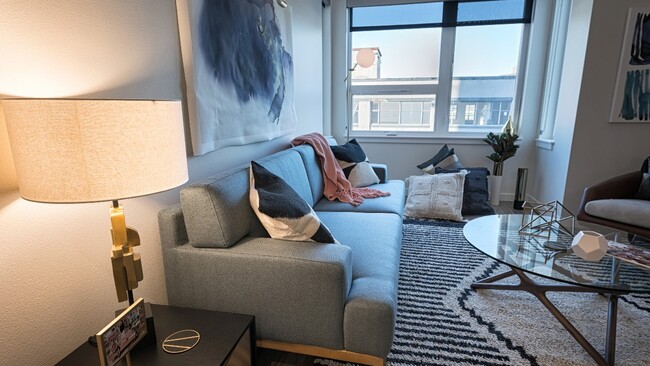 Cozy living areas with oversized windows - Modera South Lake Union