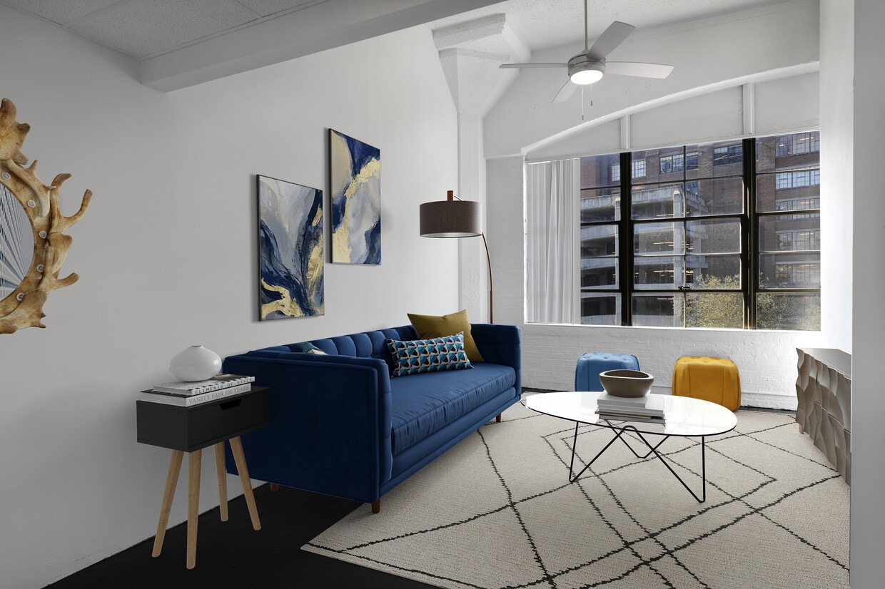 Factory Windows Living Room Blue Couch - Ford Factory Lofts