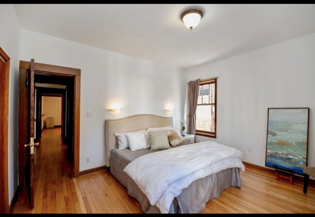 bedroom 1; king sized bed pictured - 1653 E 55th St