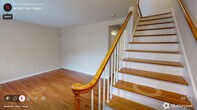 Located at 1000 N Duke St in Durham, NC, this two-story, 2-bedroom, 2-bathroom home offers a well-organized layout spread across two floors. The main level features a welcoming living room with warm hardwood flooring, neutral-toned walls, and a window that brings in natural light. A classic wood staircase with white balusters and a polished wood handrail connects the two floors. The kitchen is bright and functional, outfitted with white shaker-style cabinetry, granite-look countertops, white appliances including an electric range, and a window overlooking the outdoors. A pantry provides additional storage. Both bathrooms are clean and practical, with one featuring a full tub-shower combo with white tile surround and brushed nickel fixtures. The upper level hosts both bedrooms, each finished with the same warm hardwood floors, textured ceilings, and windows that admit natural light. The primary bedroom offers generous proportions, while the second bedroom features built-in closet storage. An additional closet provides further organization throughout the home. The overall ambiance is clean, neutral, and move-in ready, offering a functional and comfortable layout suited for everyday living.