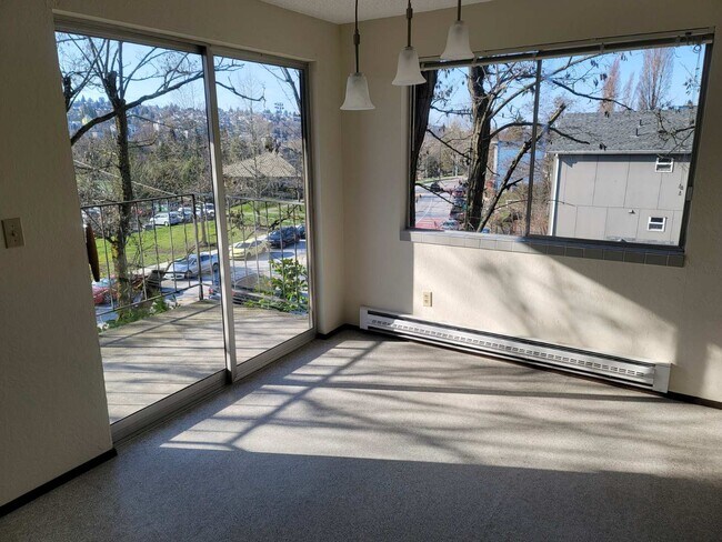 Dining area with view of outside and balcony - 4556 Delridge Way SW