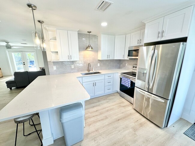 Building Photo - ** BONITA SPRINGS ** 3 BED / 1 BATH - SINGLE FAMILY HOME - NO HOA! - WATERFRONT LOT - ANNUAL RENTAL
