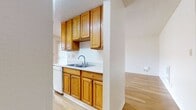 This 750 square foot single-story residence offers a thoughtful layout with 4 bedrooms and 1 bathroom. The home's interior is characterized by a blend of wood and carpet flooring, creating a warm and inviting atmosphere. The kitchen stands out with its rich wood cabinetry, white appliances, and ample counter space, making it both functional and visually appealing.

The living areas benefit from large sliding glass doors that flood the space with natural light and provide access to the outdoors. Bedrooms feature plush carpeting and closet space, with the primary bedroom measuring a comfortable 160 square feet. The bathroom is efficiently designed with a shower/tub combination and a single vanity.

Throughout the home, white walls and textured ceilings contribute to a bright, airy feel. The property's layout, as seen in the 3D floor plan, shows a well-organized space that maximizes the available square footage. This home offers a balance of comfort and practicality, ideal for those seeking a compact yet functional living space in Salinas, California.