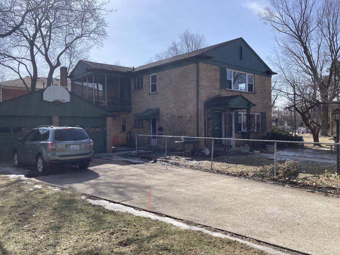 Driveway, garage, basketball hoop, and house. - 1312 Brooklyn Ave
