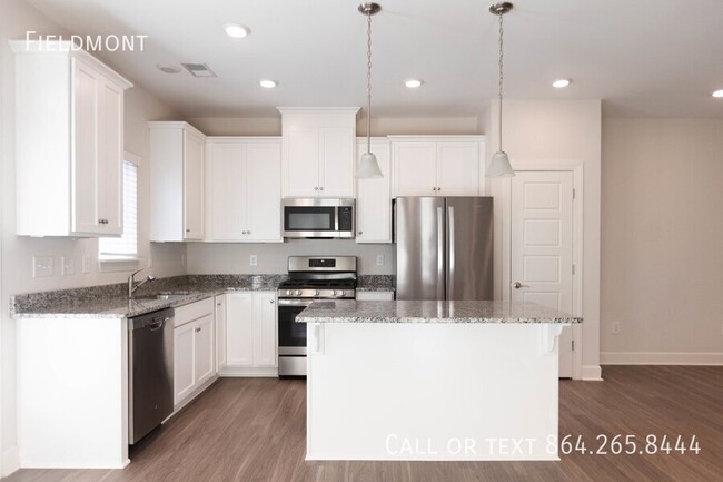 Building Photo - Like-New Townhome with a Fence & Garage!