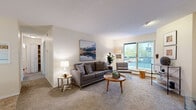 Located at 83 Michener Dr in Regina, Saskatchewan, this well-appointed 2-bedroom, 1-bathroom unit is thoughtfully laid out across a single floor, offering an efficient and comfortable living space. The living room serves as the heart of the unit, featuring plush carpeting, a textured ceiling, and a large sliding glass door that opens onto a private balcony, flooding the room with natural light and offering outdoor views. The adjoining dining area provides a dedicated space for meals, while the kitchen is equipped with white cabinetry, dark granite-style countertops, tile flooring, and a white electric range. The primary bedroom is a comfortable retreat with a large window that brings in generous natural light, carpeted floors, and ample room for furnishings. The second bedroom also features carpet and is served by a walk-in closet with bifold louvered doors, offering excellent storage. The bathroom includes a vanity with a marble-style countertop and tile flooring, maintaining a clean and functional aesthetic throughout. Neutral tones and warm finishes create a cohesive, inviting atmosphere across all rooms, making this unit a practical and comfortable home in a residential Regina neighbourhood.