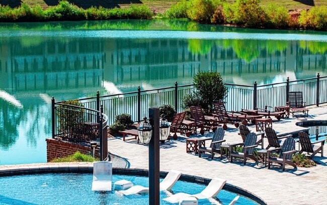 Italian marble tile pool deck overlooking the lake - Wellington Place Apartments