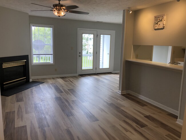 Open concept living room w/ fireplace, deck - 250 Waterdown Dr