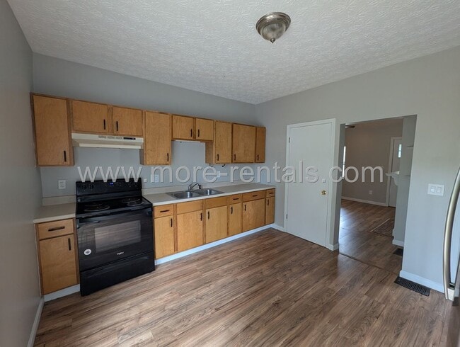 Building Photo - Remodeled home with fenced yard and large deck